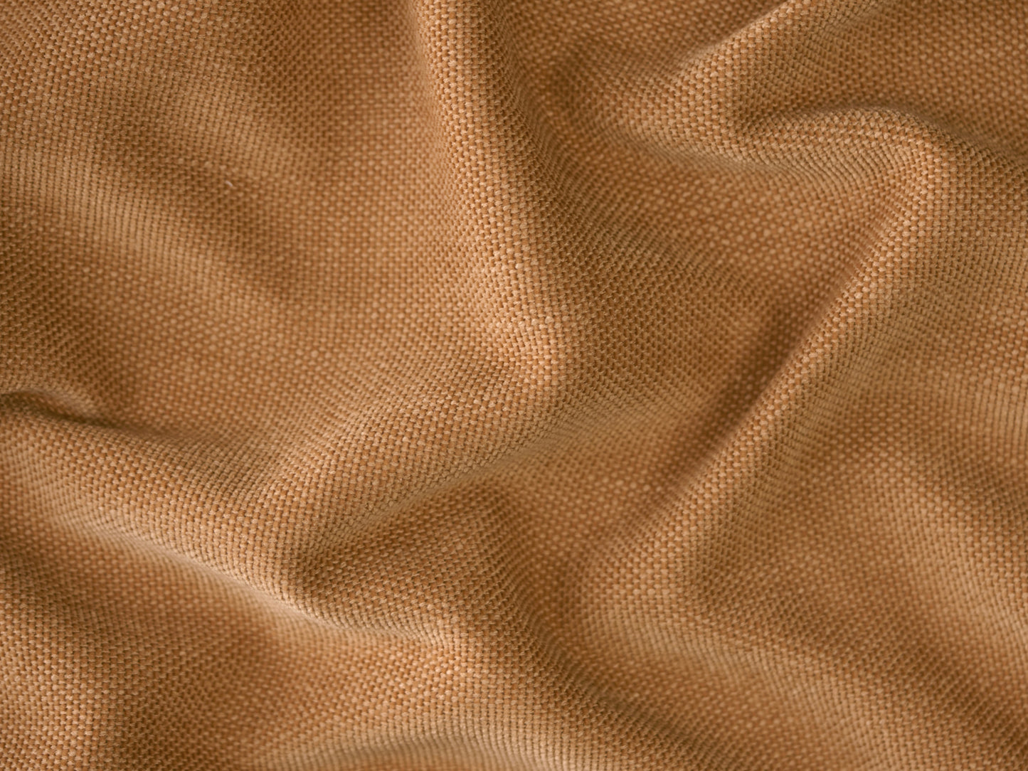 Luxurious tan leather fabric with a soft, pebbled texture, ideal for high-end, modern sofas. Rich, earthy tone perfect for elegant living spaces.
