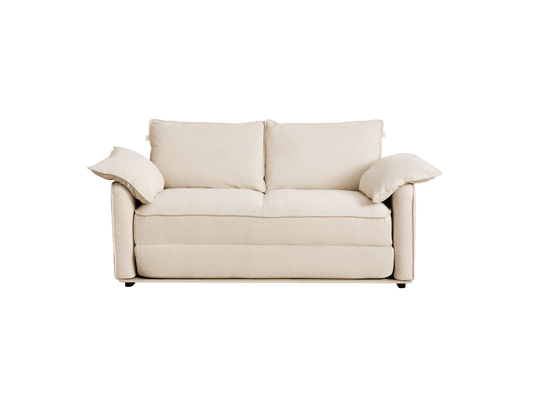 A cozy, light beige sofa with two large cushions and gently curved arms, set against a black background.