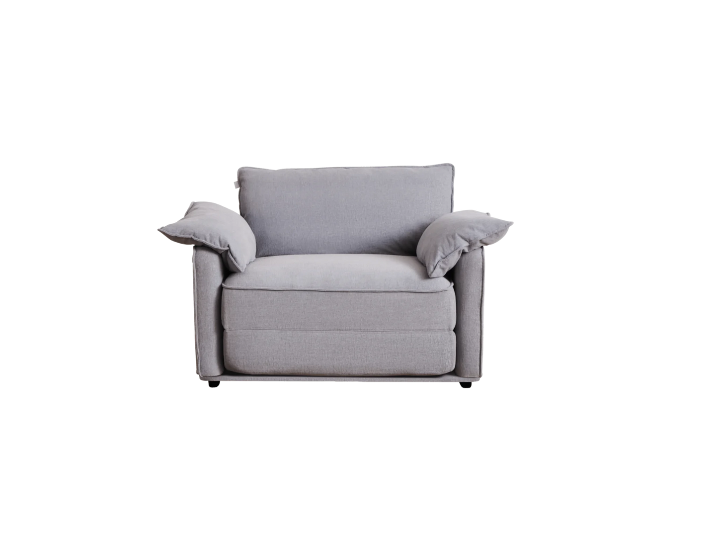 A light grey, modern armchair with soft, plump cushions and rounded edges, featuring two matching throw pillows on either side.
