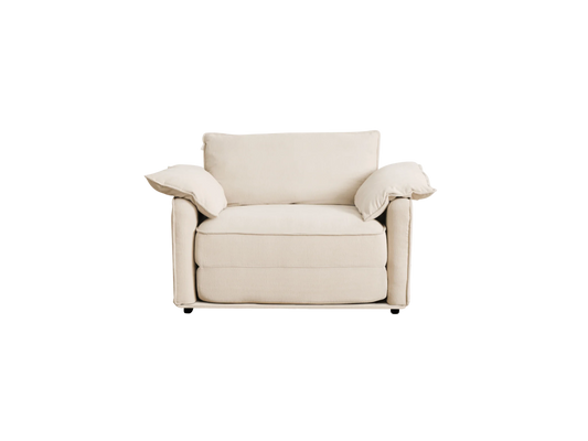 A beige, two-seater sofa with plush cushions and wide armrests, featuring a minimalist design and soft fabric upholstery.