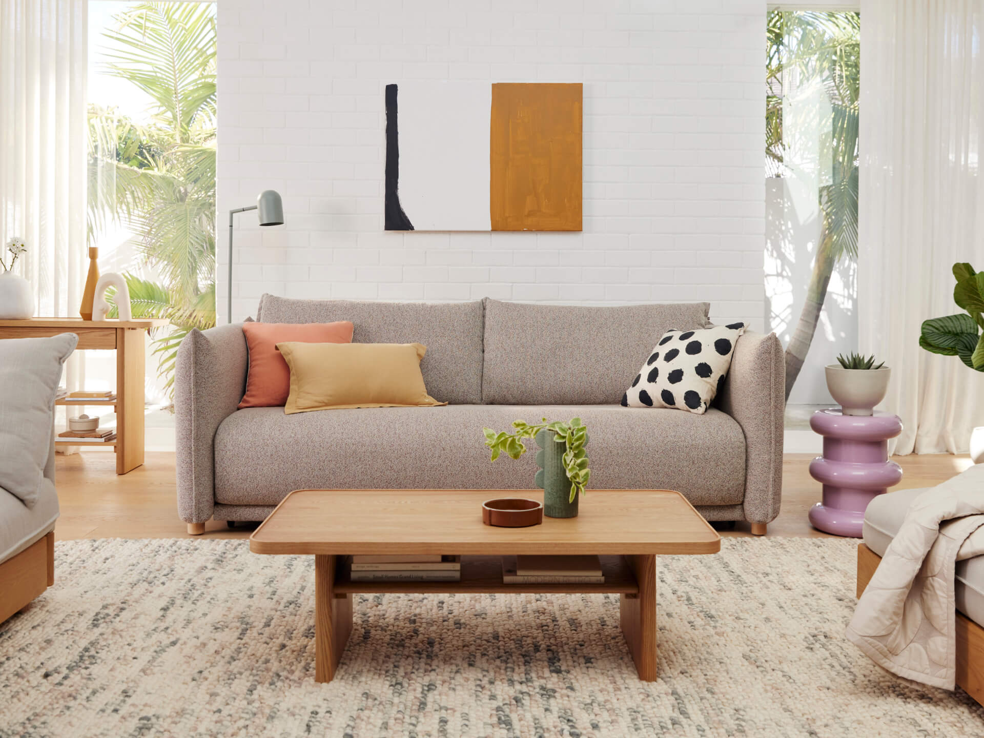 Byron Sofa Bed in a stylish living room — a deep-seated sleeper sofa with hidden storage