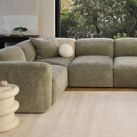 beautiful green modular sofa in a modern living room