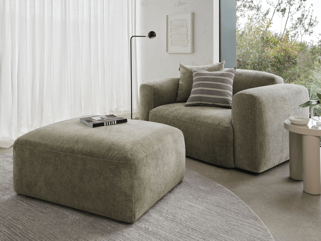 Armchair and ottoman in minimalist living room