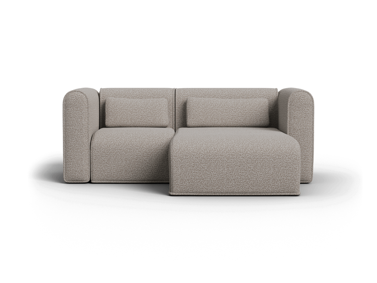 Modern beige boucle sectional sofa with plush cushions, featuring an L-shaped configuration. Elegant and minimalist, ideal for a luxurious living area.