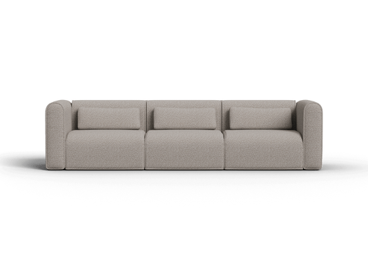 Luxurious modular three-seater sofa in soft grey fabric with plush cushions. Rounded armrests, clean lines. Perfect for a modern living room setting.