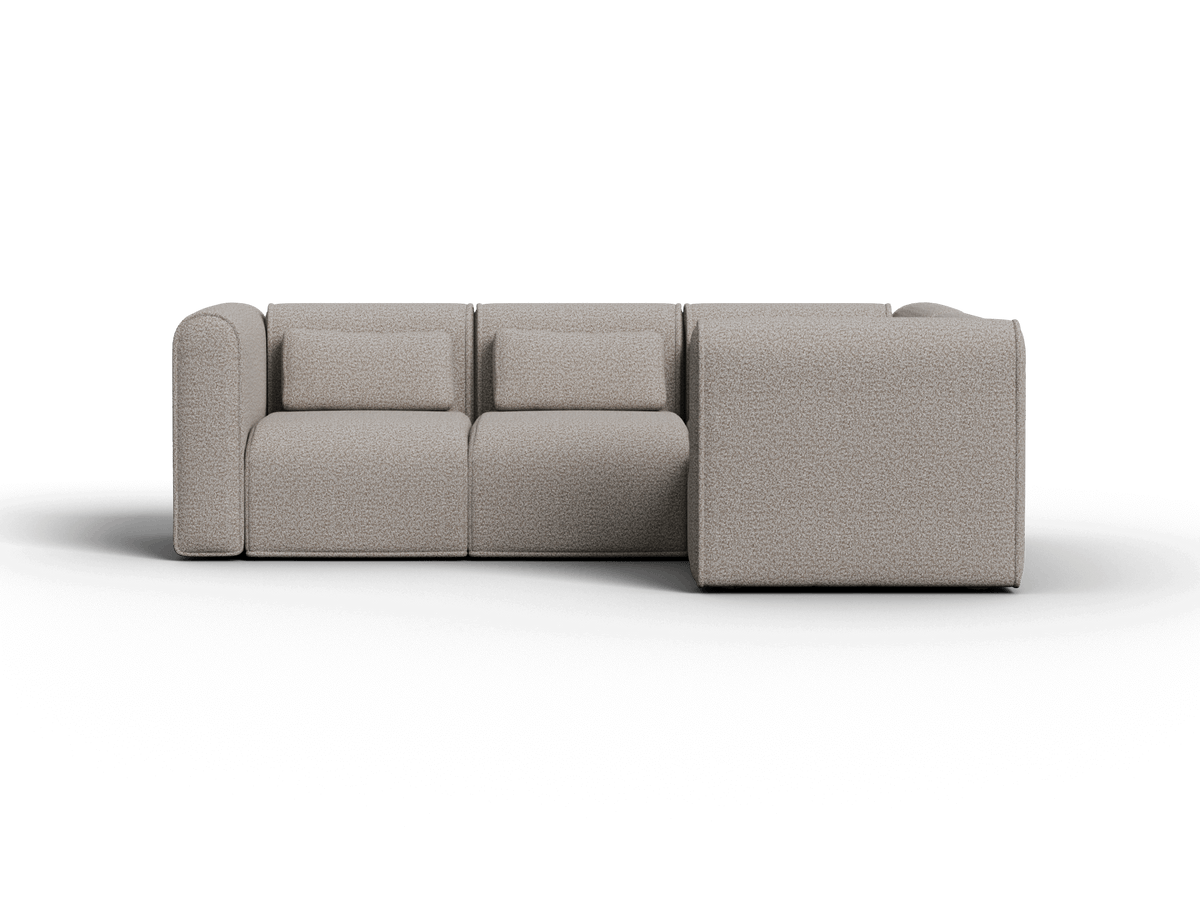 Luxurious modular sectional sofa in sophisticated beige fabric. Features plush cushioning and clean lines, perfect for a contemporary living space.