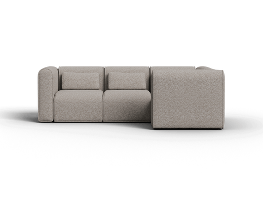 Modern grey fabric sectional sofa with plush cushions and minimalist design, set in a contemporary living room. Combining style and comfort seamlessly.