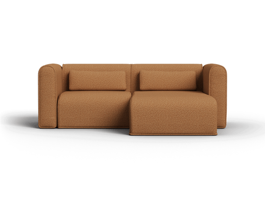 Contemporary brown boucle fabric sofa with left-facing chaise. Features plush cushions and rounded armrests. Set in a minimalist interior for luxury living.