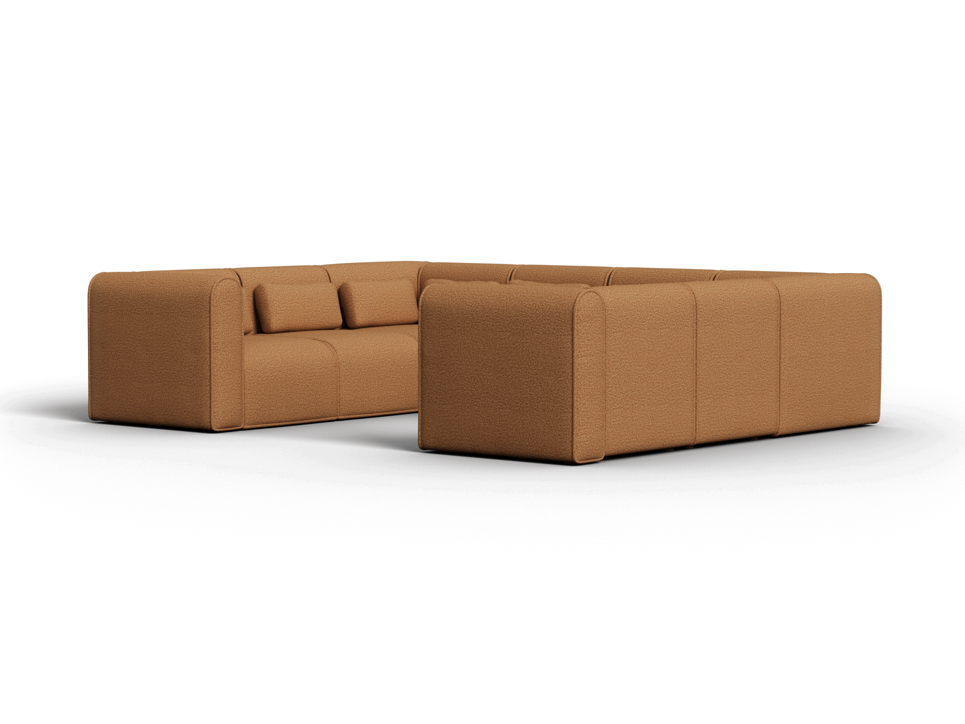Contemporary modular sectional sofa in warm caramel fabric, featuring rounded edges, plush cushions, and a sleek design, situated in a modern living space.