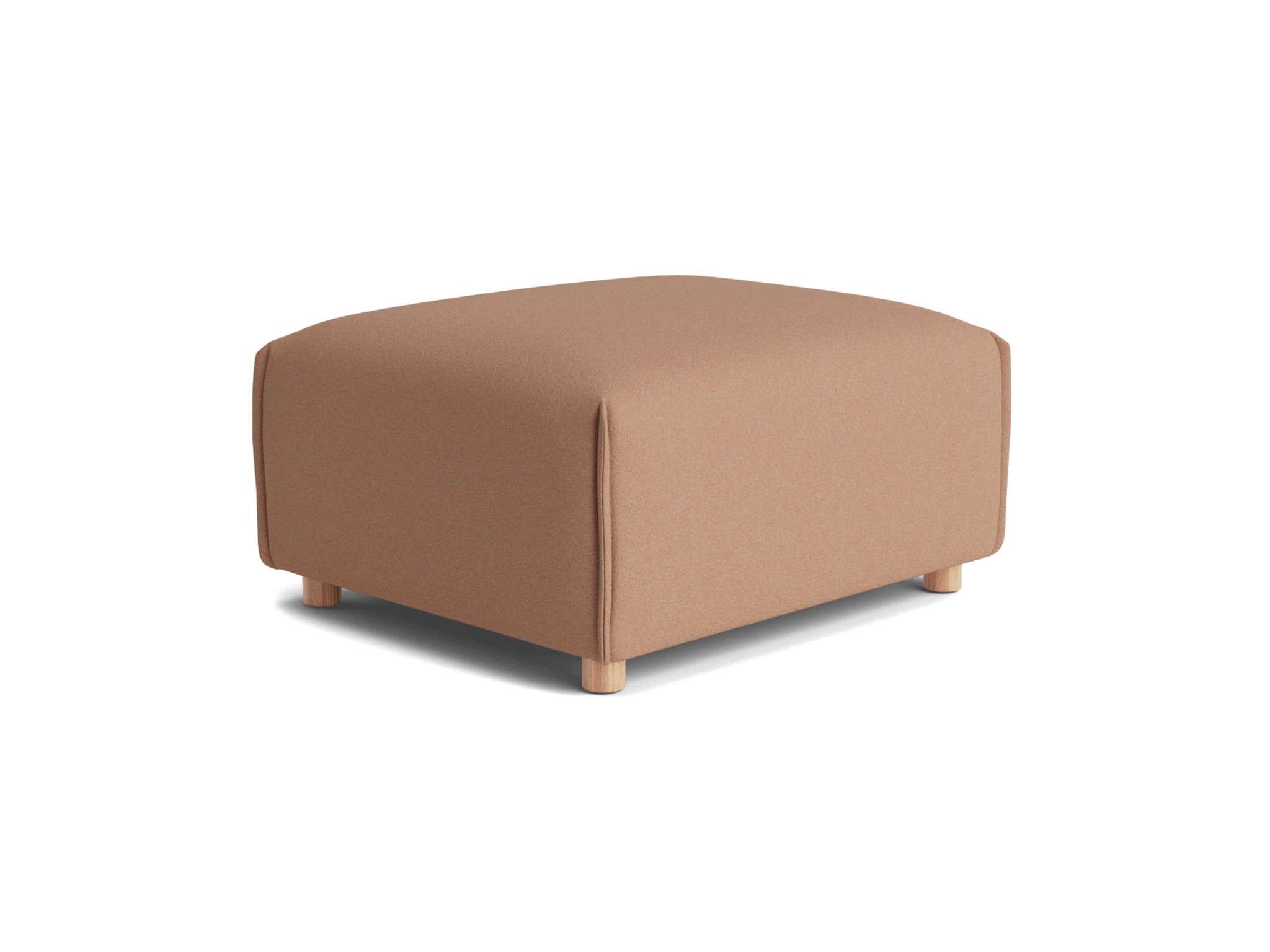 A soft, light brown ottoman with rounded edges, resting on four light wood legs against a black background.