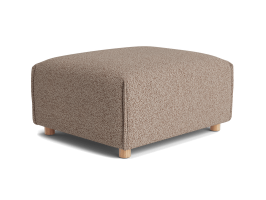 A square, light brown ottoman with a textured fabric and natural wooden legs, positioned against a black background.