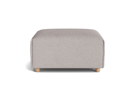 A light grey ottoman with rounded edges and wooden legs, set against a transparent background.