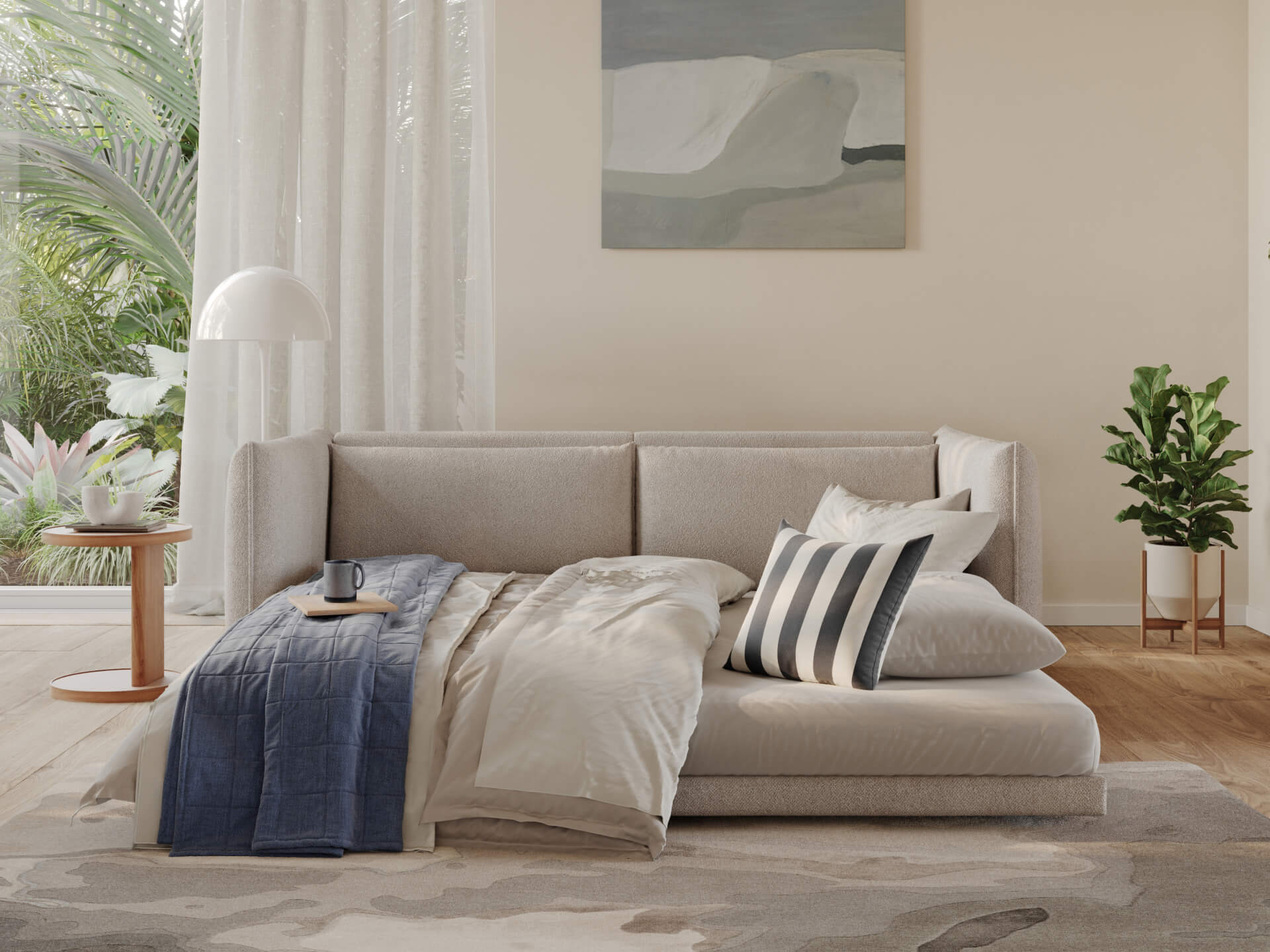 A light grey sofa with a blue throw, white and striped pillows, beside a wooden side table with a black mug, against a backdrop of plants and sunlight.