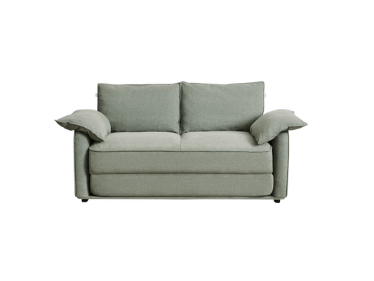 A modern, light green sofa with two large cushions and two arm cushions, set against a black background.