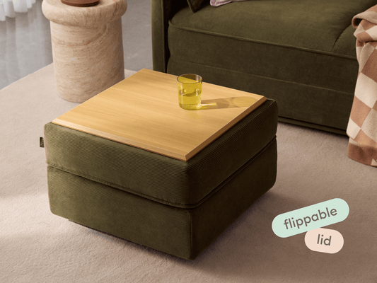 Luxurious olive green ottoman with a chic wooden lid, flippable for versatile use. Perfectly complements modern interiors with its dual-functionality design.