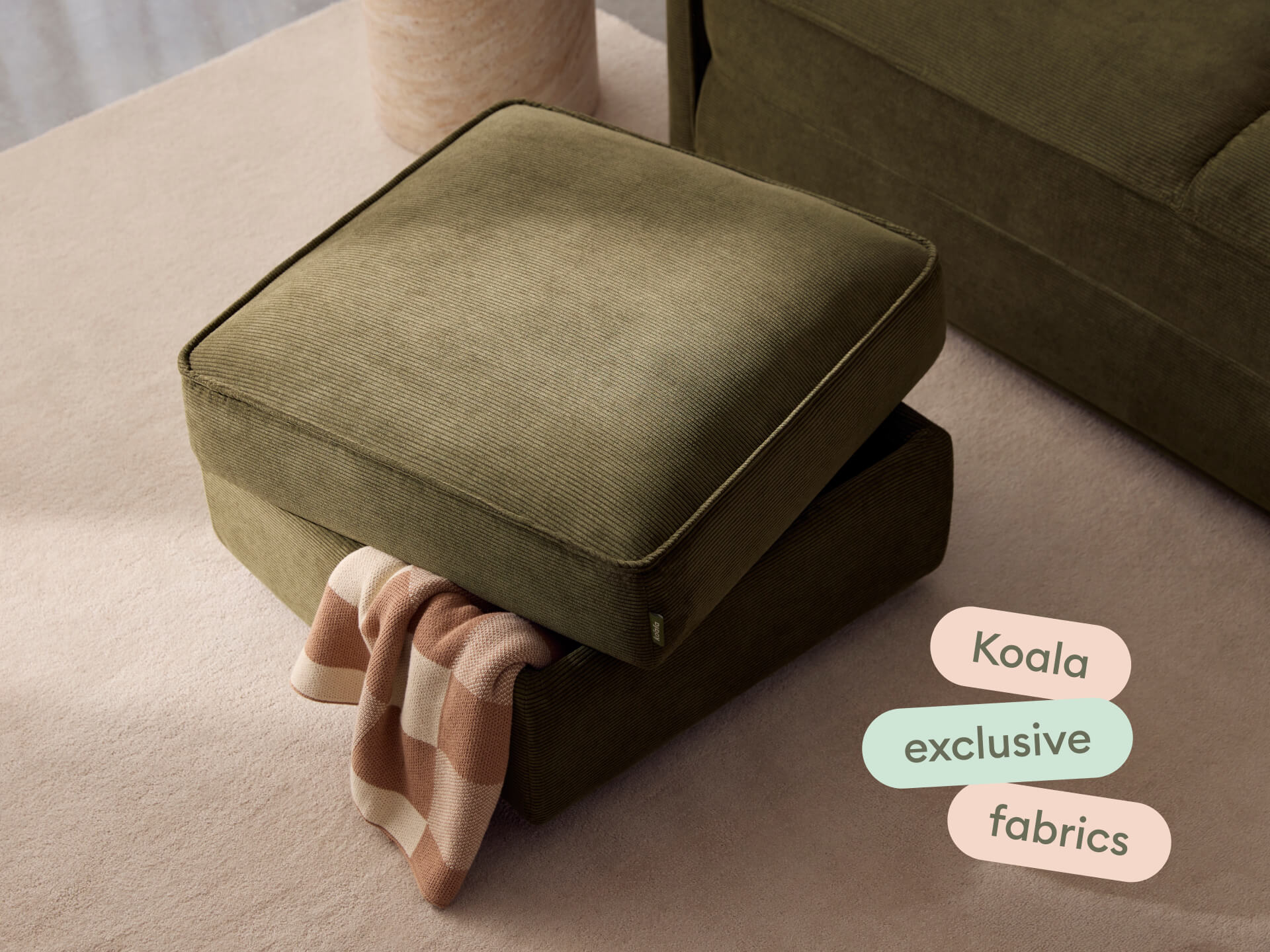 Luxurious olive ottoman in premium fabric, featuring a plush cushion and minimalist design. Elegantly placed in a modern living room with neutral tones.