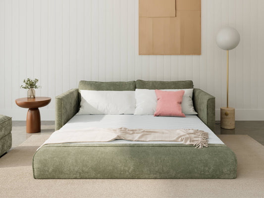 Koala Cushy Sofa Bed in sage green unfolded into bed mode in styled room