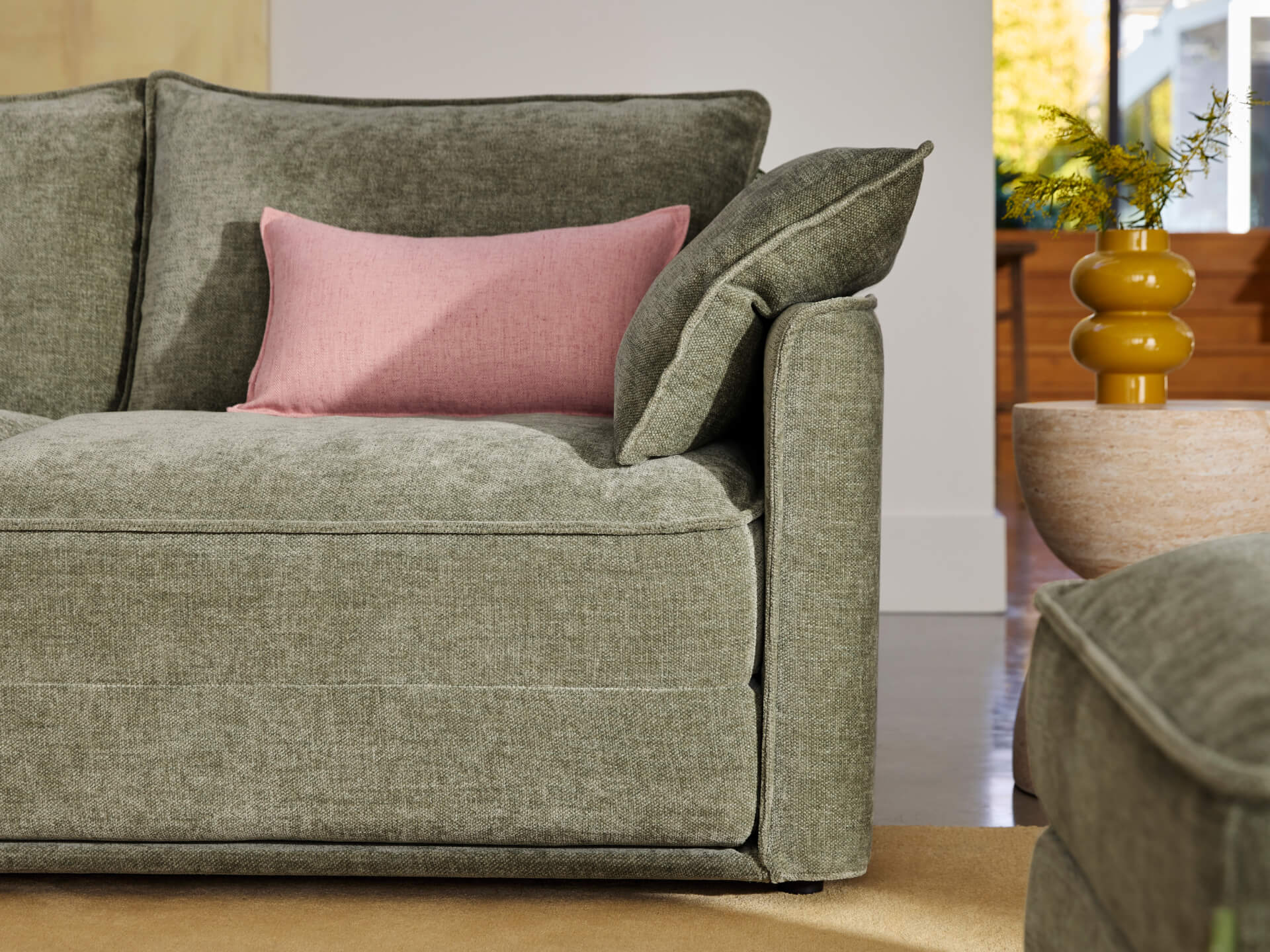 Koala Cushy Sofa Bed in sage green close-up detail of fabric and stitching
