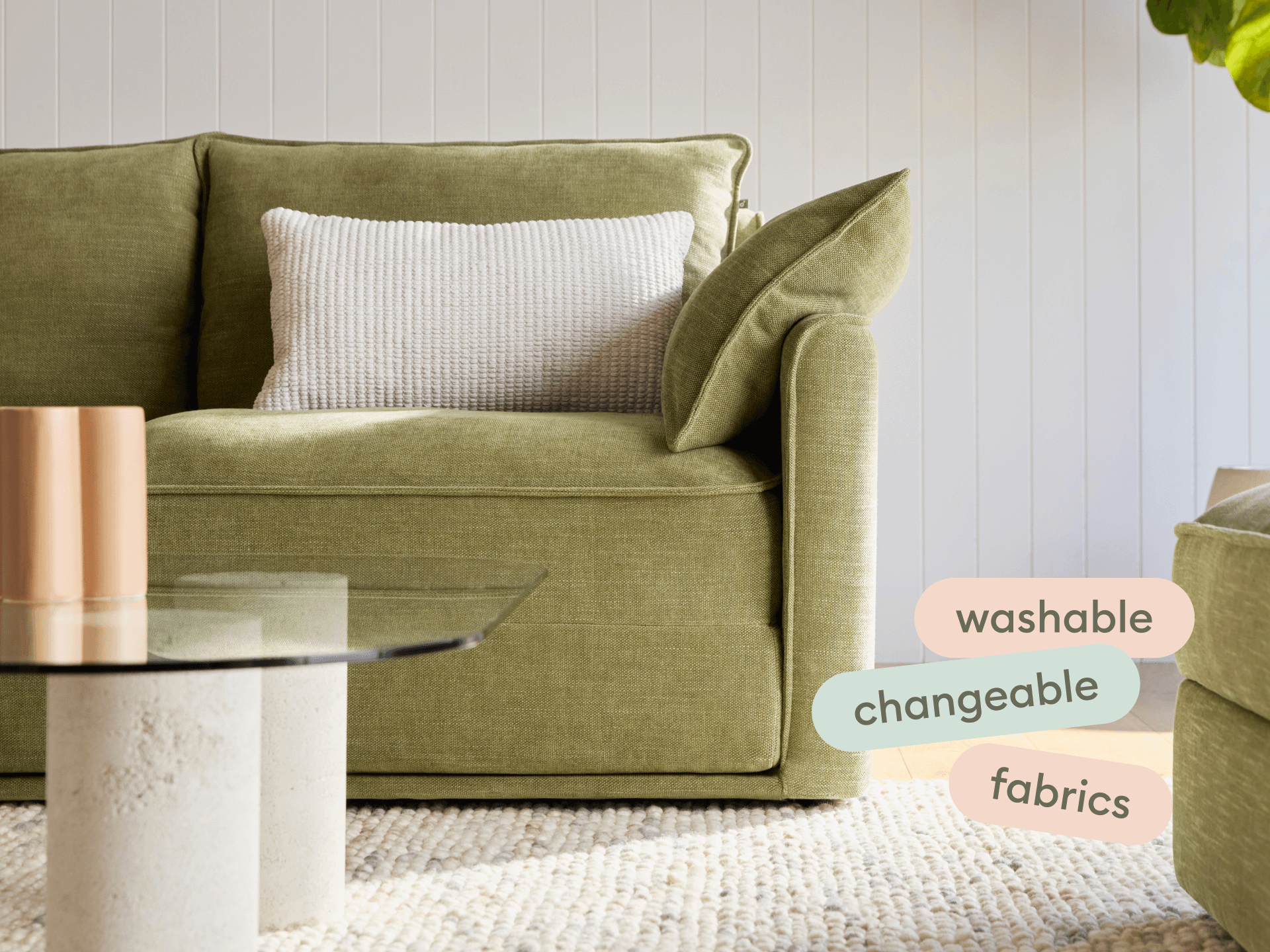 Olive green Koala Sofa Bed in a stylish, light-filled living room with a modern coffee table
