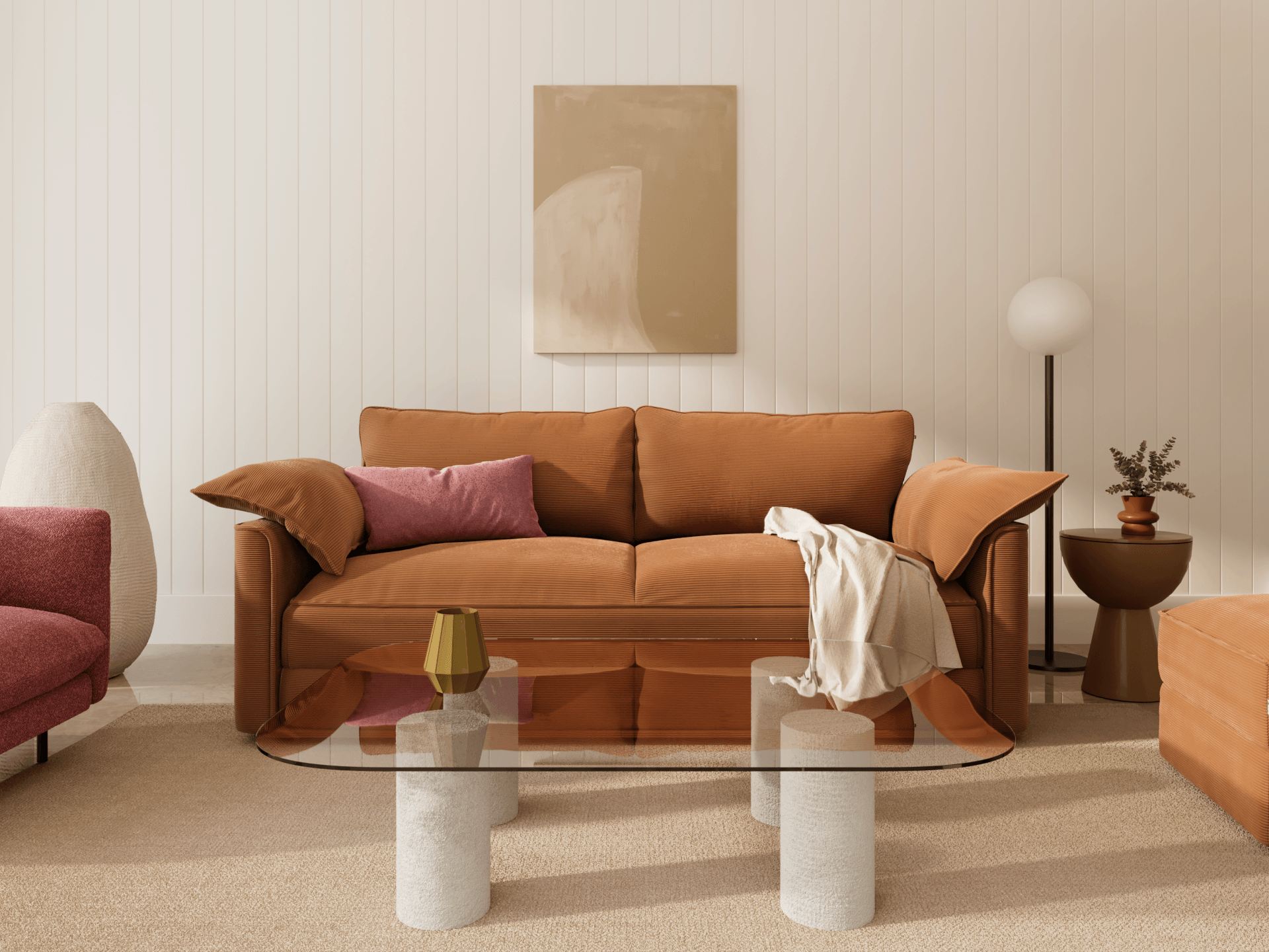 Koala Sofa Bed King in terracotta corduroy in styled living room with glass coffee table and cushions