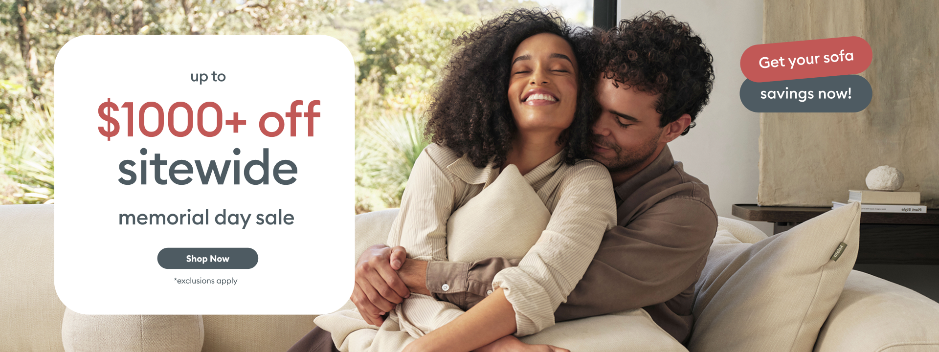 Up to $1000+ off sitewide memorial day sale' card beside smiling couple embracing on cream Koala sofa