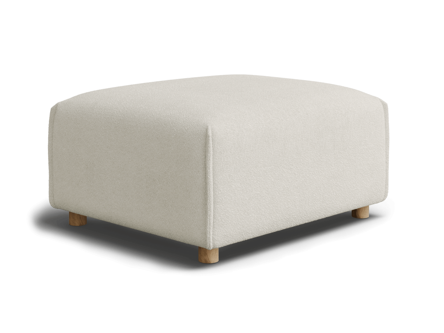 A soft, off-white ottoman with rounded corners and natural wood legs, set against a black background.