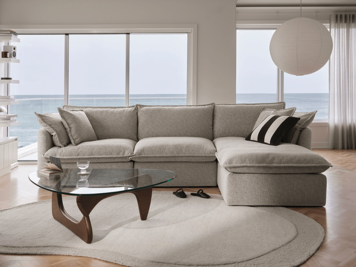Koala Tamarama 3-section chaise modular sofa in Aussie Latte, with monstera plant and Noguchi glass table