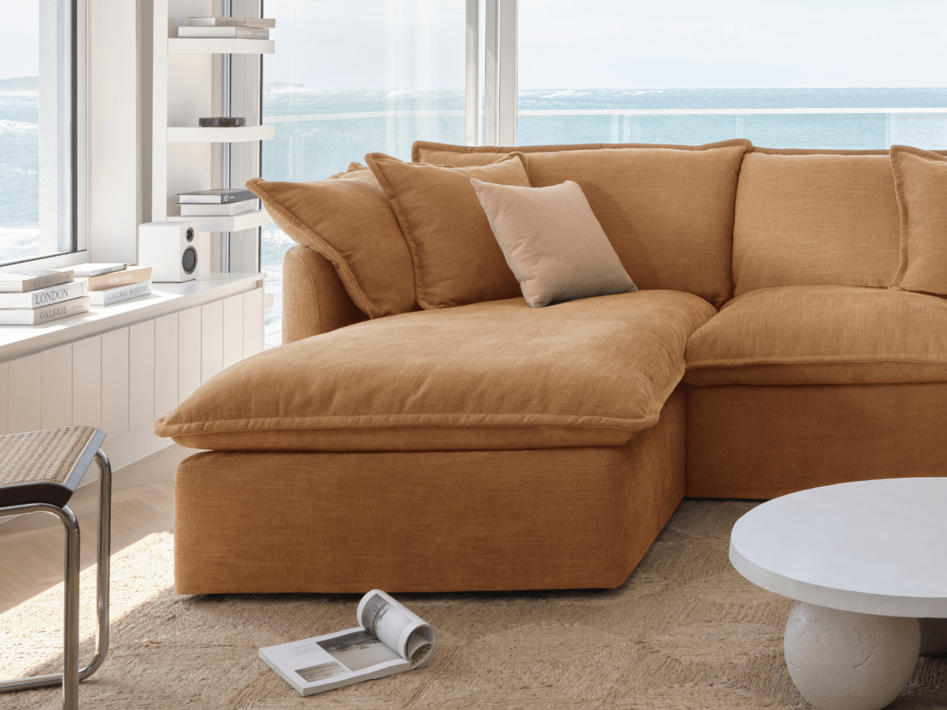 Koala Tamarama 2-section chaise modular sofa in Bronzed Aussie, with monstera plant and terracotta velvet cushion