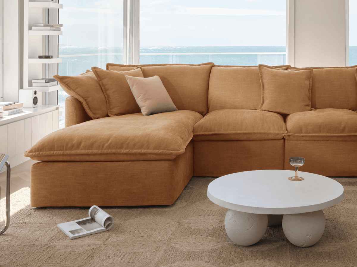 Koala Tamarama 3-section chaise modular sofa in Bronzed Aussie, with monstera plant and Noguchi glass table
