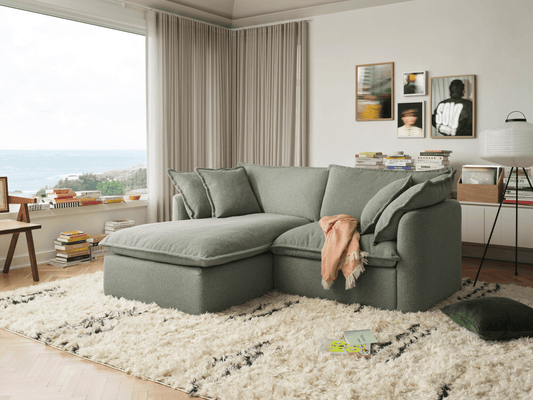 Koala Tamarama 2-section chaise modular sofa in Frosty Grass, with monstera plant and terracotta velvet cushion