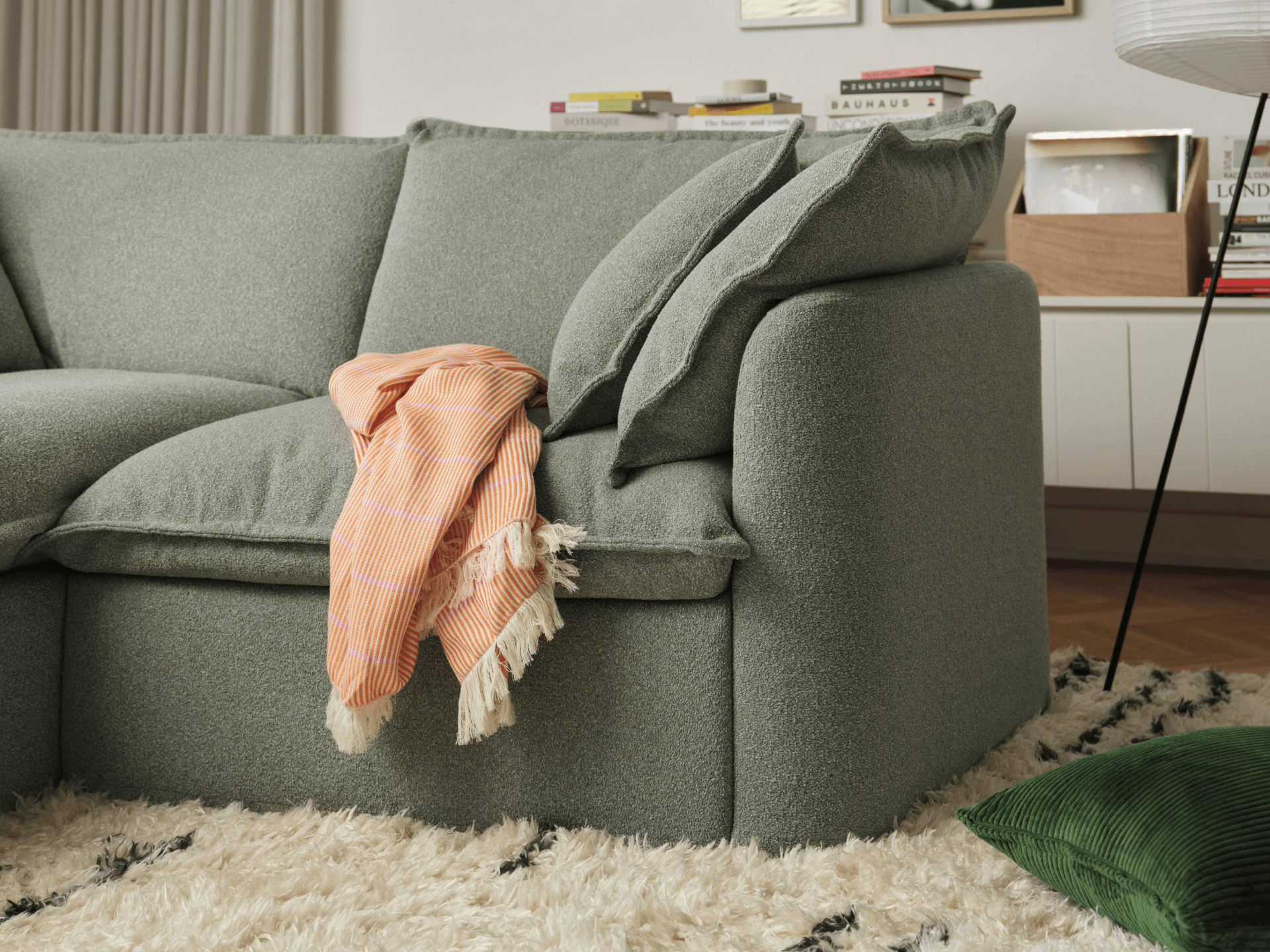Koala Tamarama 6-section U-shape sectional in Frosty Grass, linen scatter cushions with sunlit art books