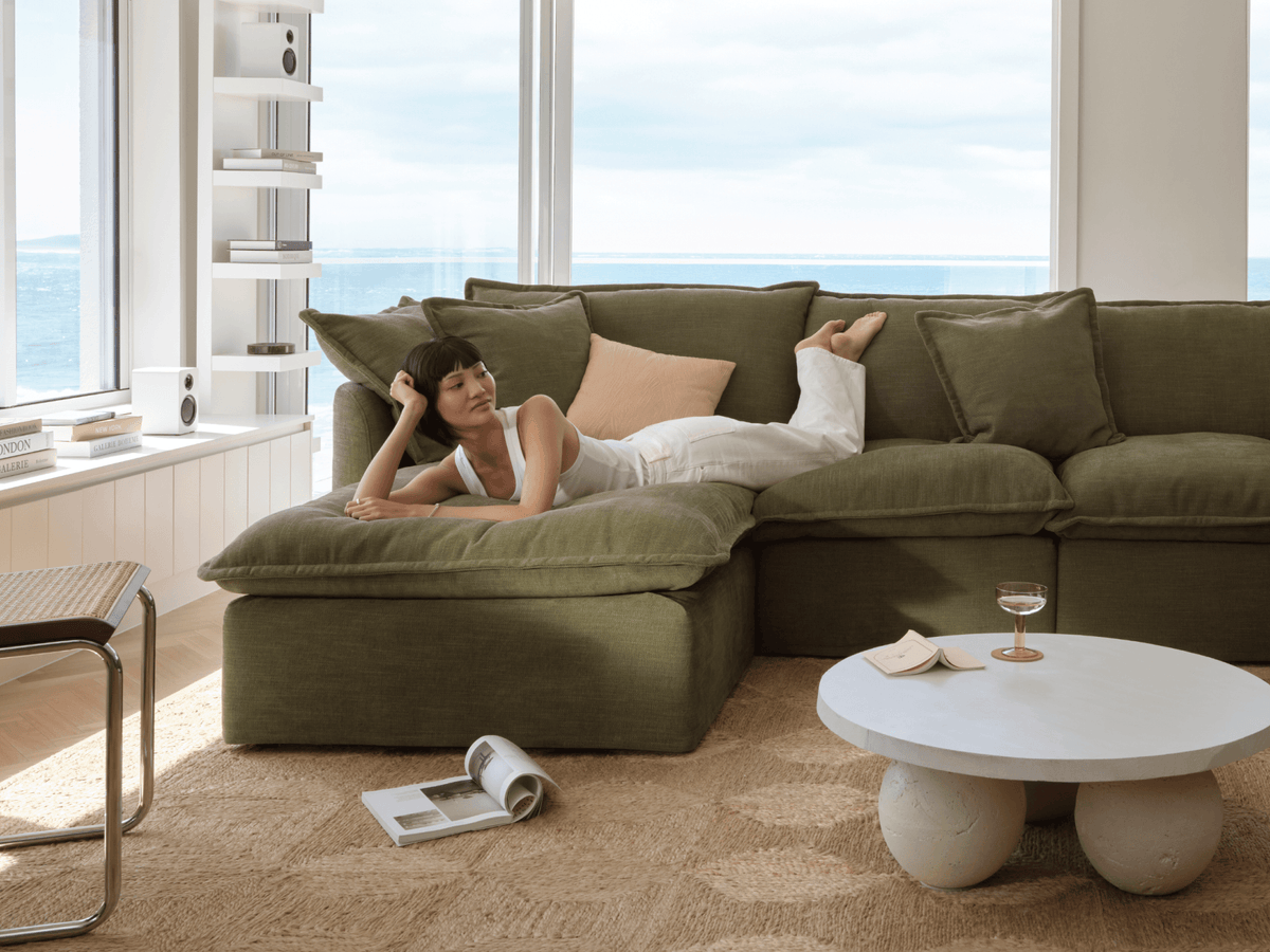 Koala Tamarama 3-section chaise modular sofa in Forest Walk, with monstera plant and Noguchi glass table