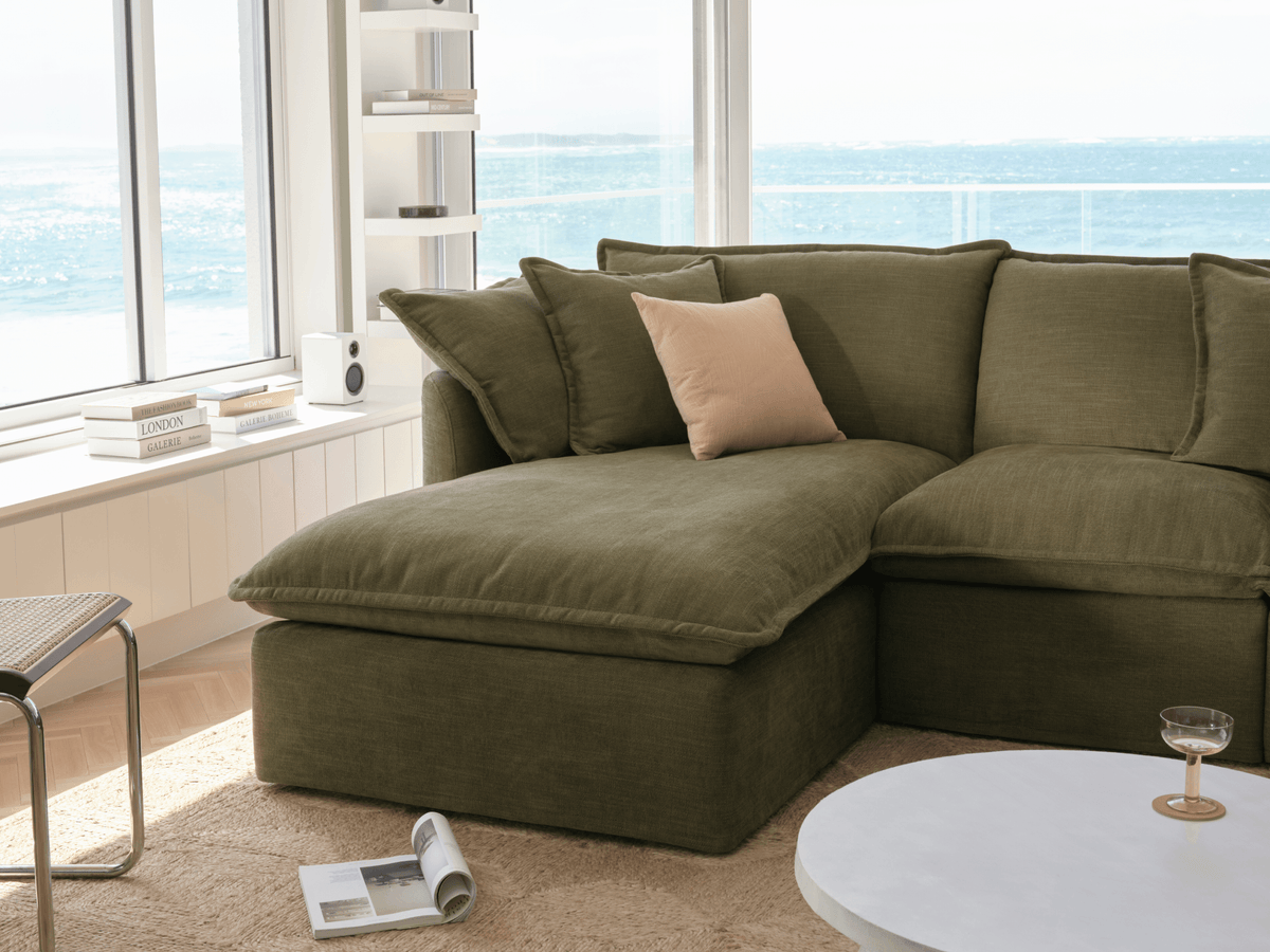 Koala Tamarama 3-section chaise modular sofa in Forest Walk, with two models reclining and terracotta cushion