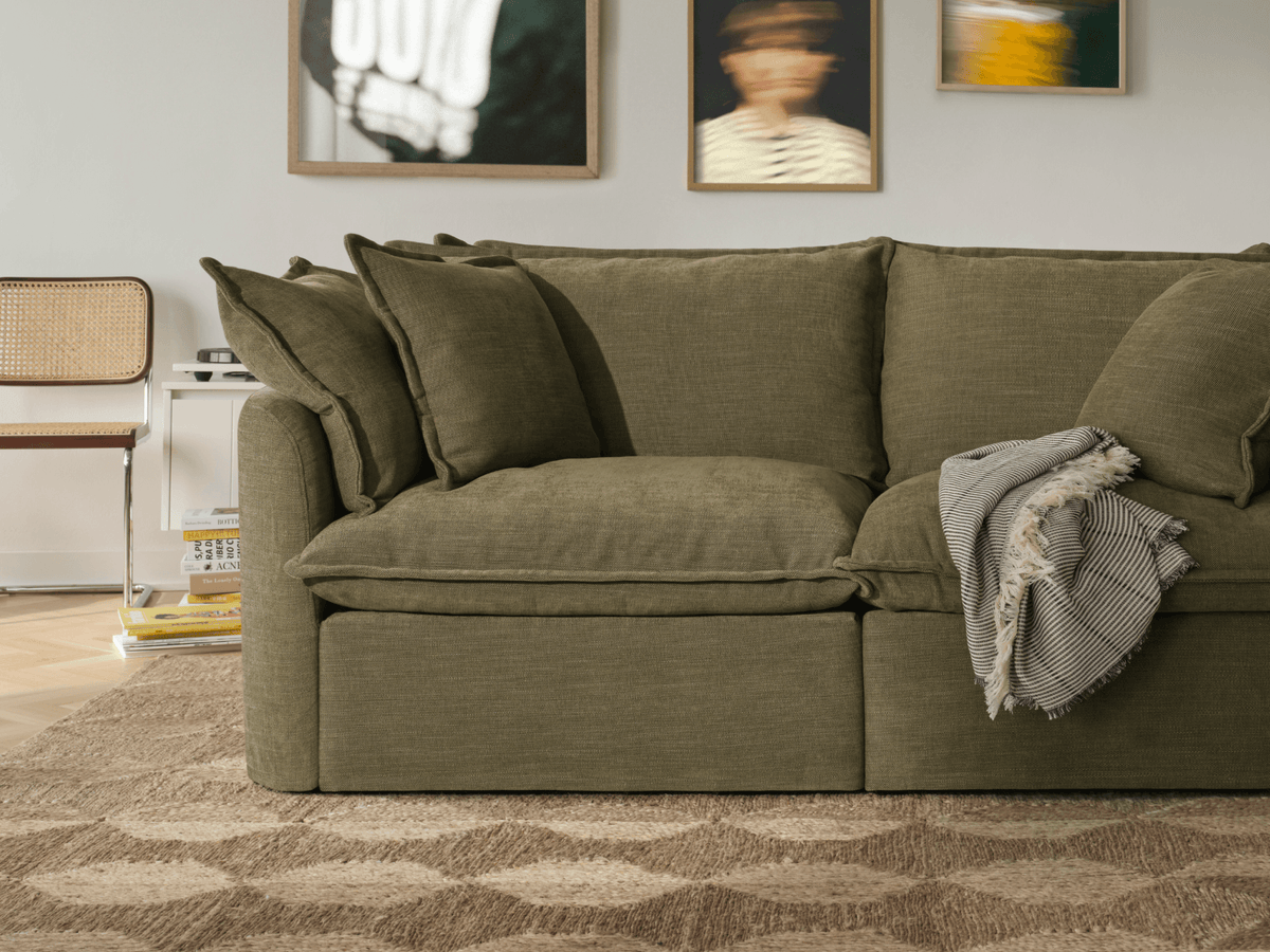 Koala Tamarama 4-section modular sofa in Forest Walk, with terracotta velvet cushion and city view