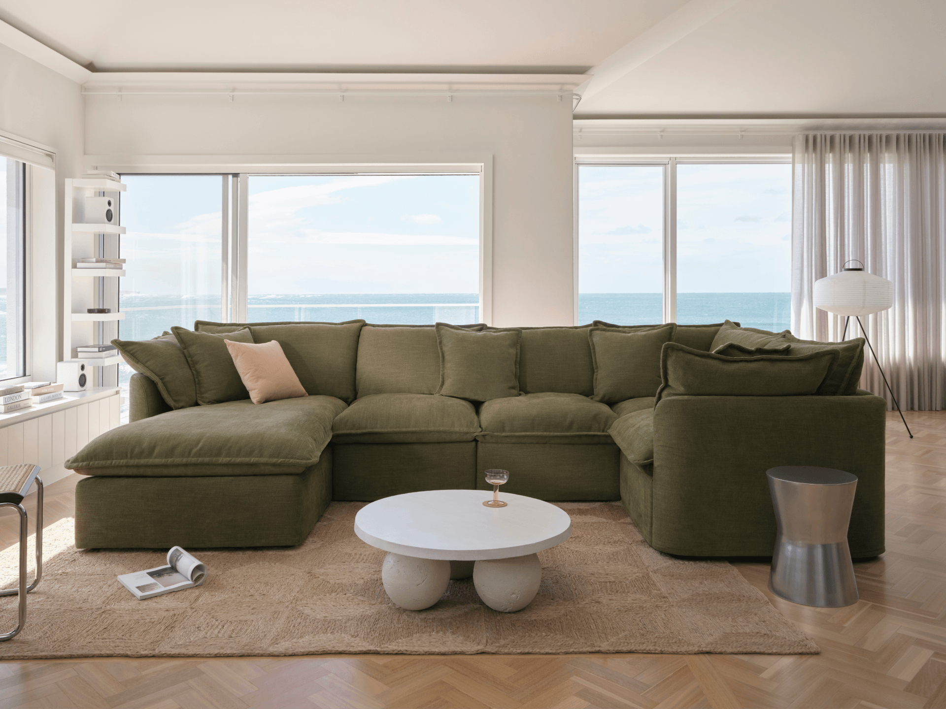 Koala Tamarama 5-section L-shape sectional with chaise in Forest Walk, with monstera plant and Noguchi glass table