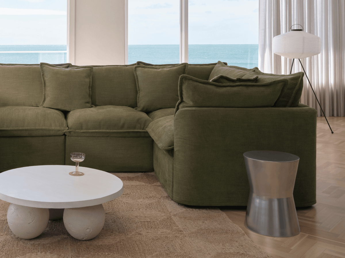 Koala Tamarama 6-section U-shape sectional in Forest Walk, linen scatter cushions with sunlit art books