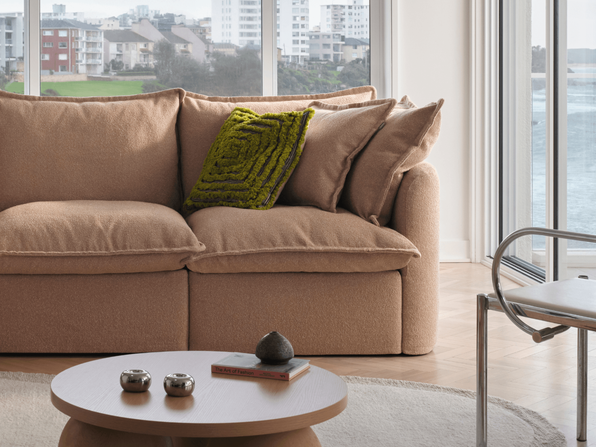 Koala Tamarama 2-section modular sofa in Pebble Beach, in coastal living room with ocean view and glass table