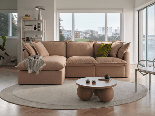 Koala Tamarama 3-section chaise modular sofa in Pebble Beach, with monstera plant and Noguchi glass table