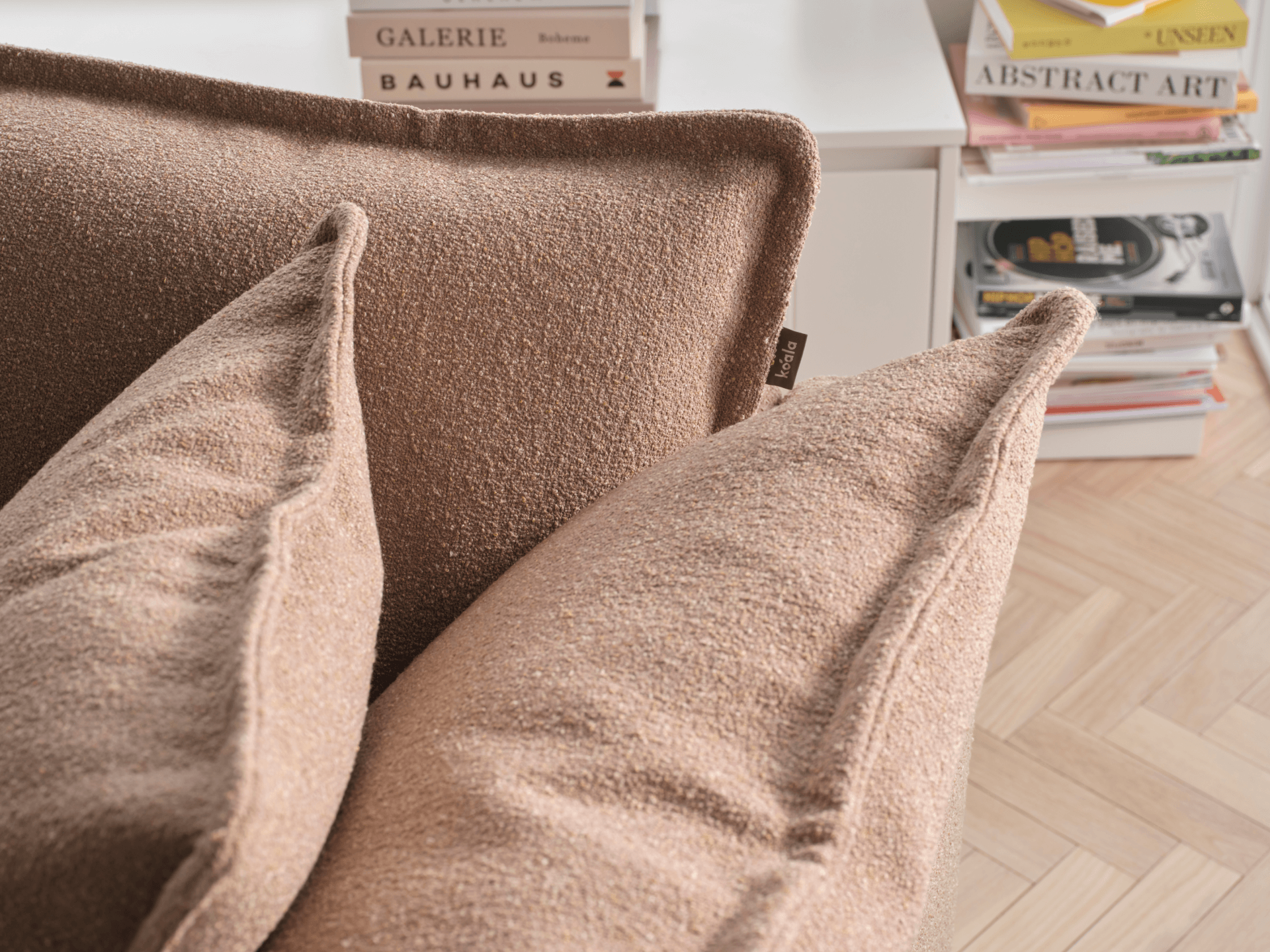 Koala Tamarama 4-section chaise modular sofa in Pebble Beach, linen scatter cushions with sunlit art books