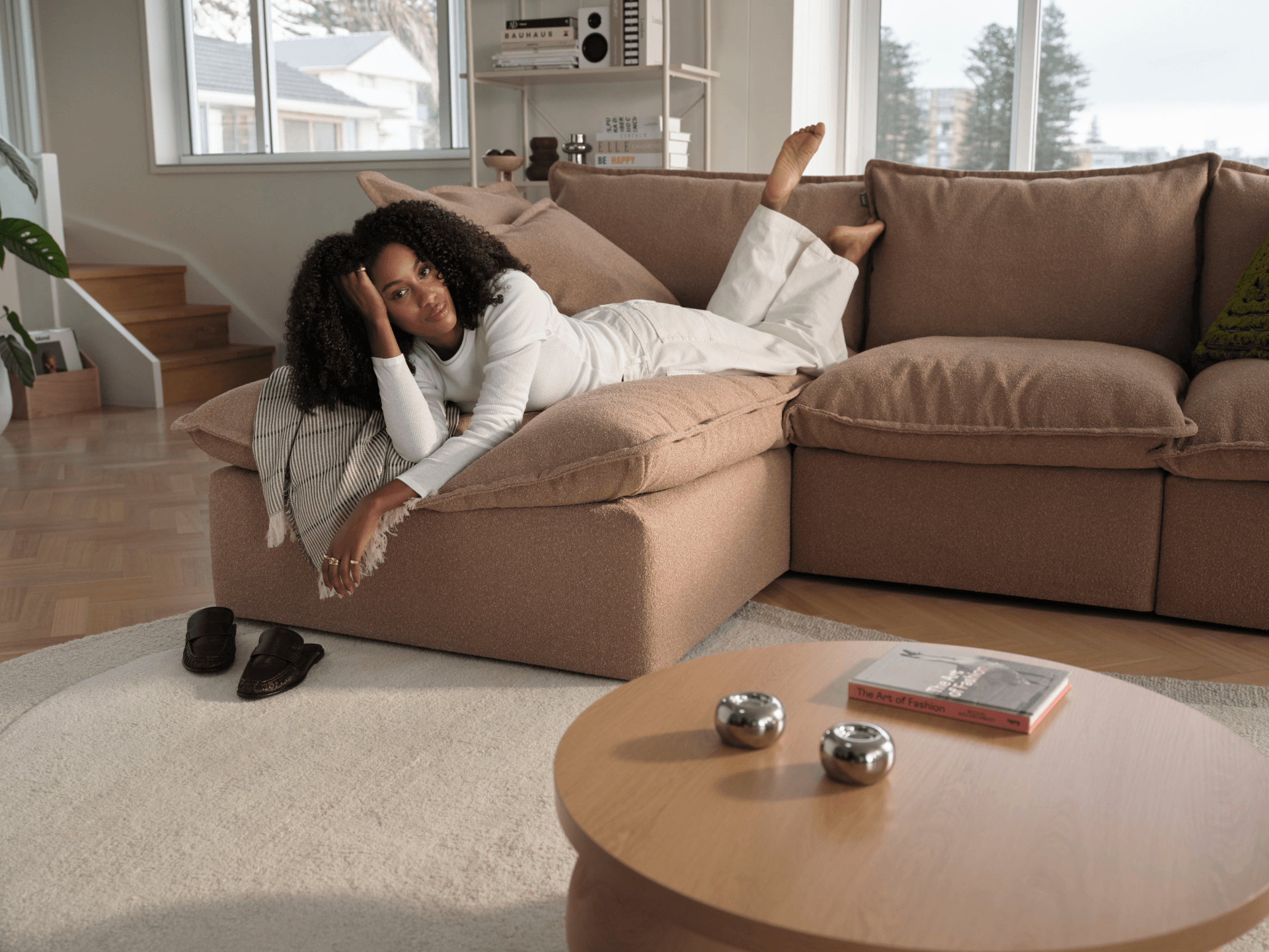 Koala Tamarama 5-section L-shape sectional with chaise in Pebble Beach, with monstera plant and Noguchi glass table