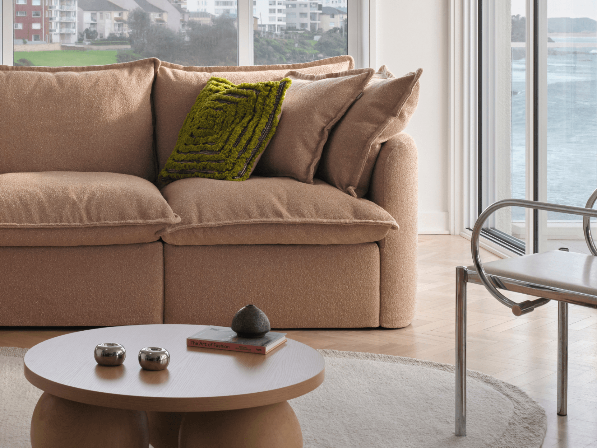 Koala Tamarama 5-section L-shape sectional with chaise in Pebble Beach, with two models reclining and terracotta cushion