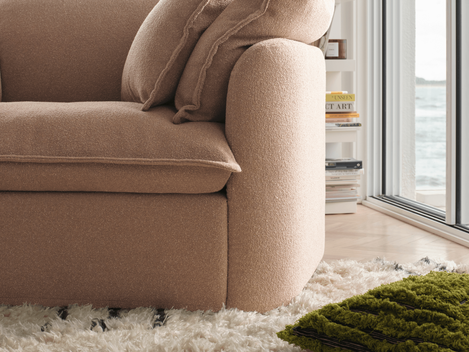 Koala Tamarama 5-section L-shape sectional with chaise in Pebble Beach, linen scatter cushions with sunlit art books