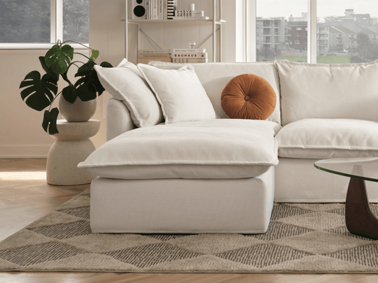 Koala Tamarama 2-section chaise modular sofa in Winter Cream, with monstera plant and terracotta velvet cushion