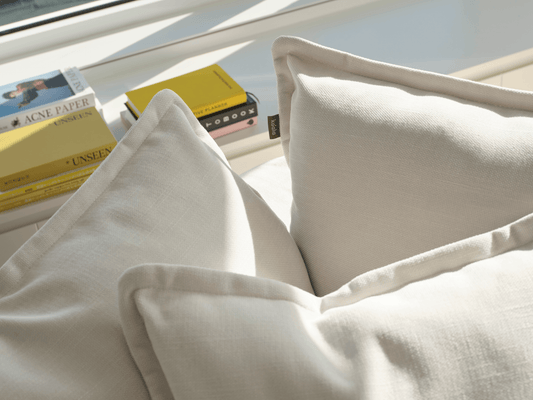 Koala Tamarama 3-section modular sofa in Winter Cream, linen scatter cushions with sunlit art books