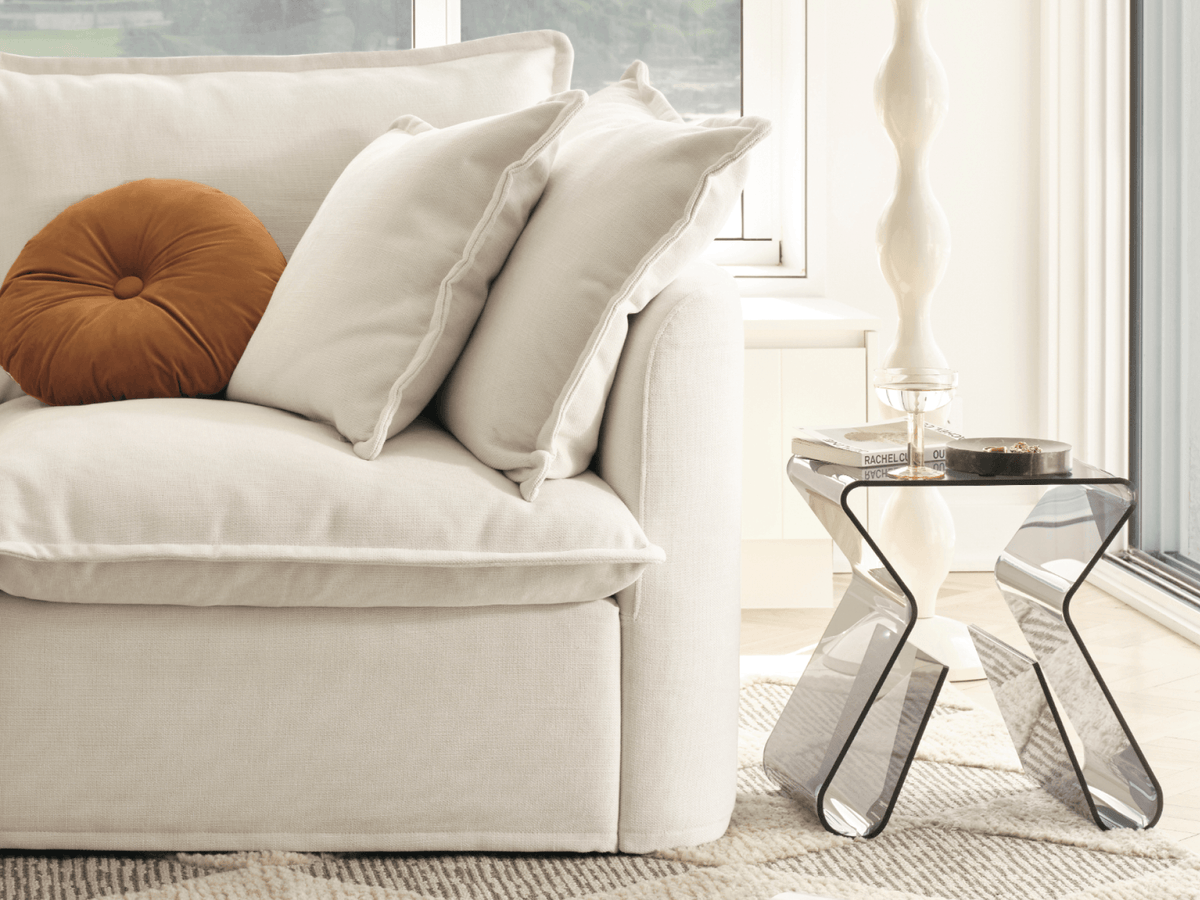 Koala Tamarama 6-section U-shape sectional in Winter Cream, corner detail with terracotta cushion and wavy lamp