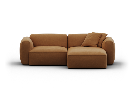 Contemporary sectional sofa in rich caramel velvet, featuring plush cushions and rounded arms, ideal for a sophisticated living room setting.