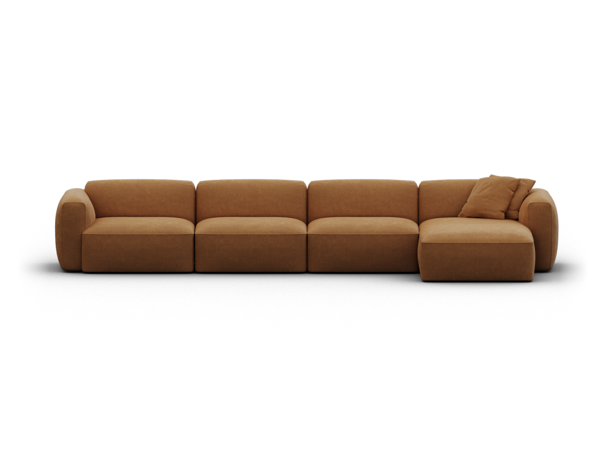 Luxurious modular sofa in rich, camel-coloured fabric. Features plush cushions and a streamlined silhouette, perfect for upscale, contemporary living rooms.