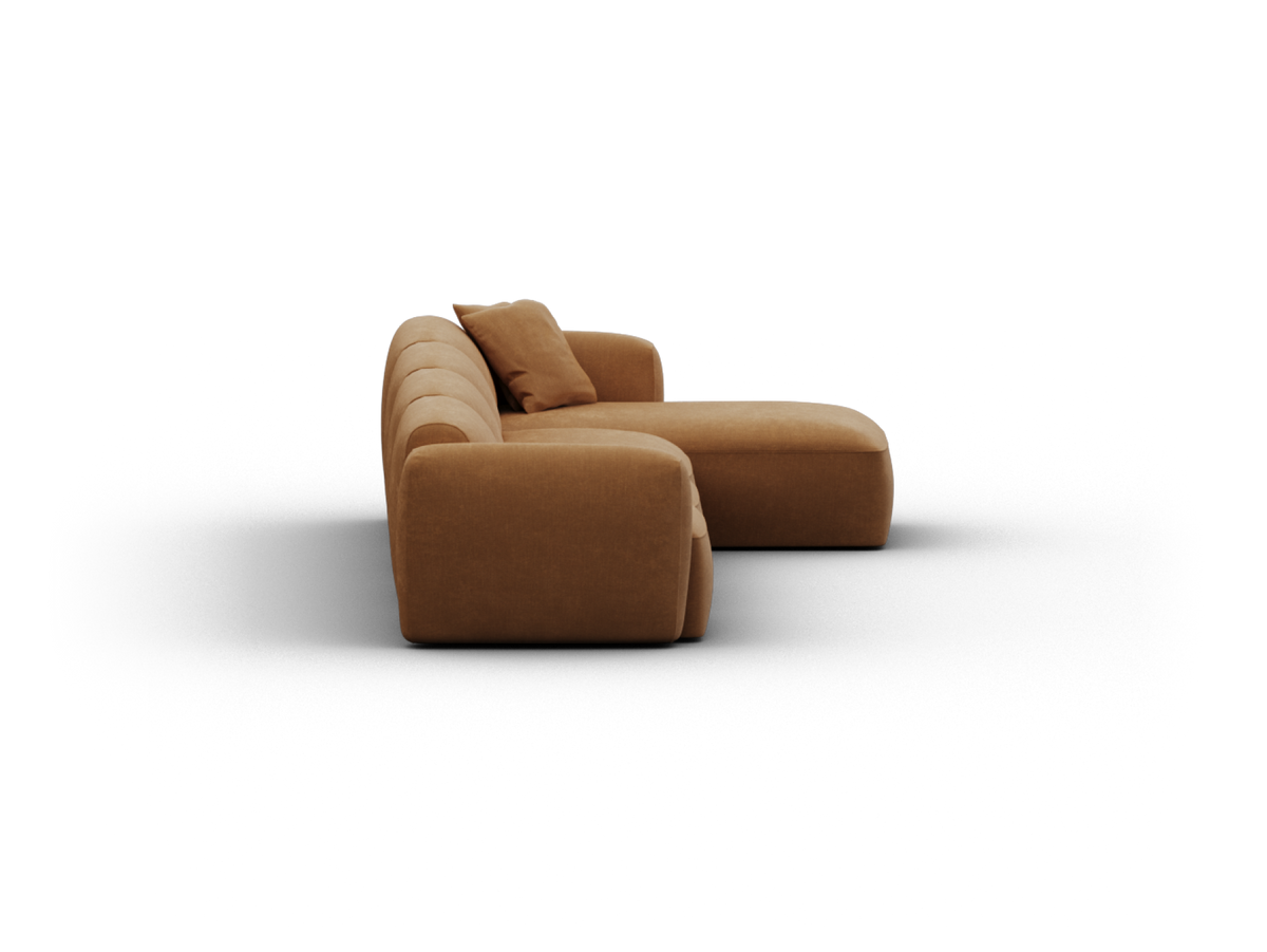 Luxurious caramel brown sofa featuring plush fabric, deep cushioning, and a chaise section. Sleek, modern design ideal for upscale living rooms.