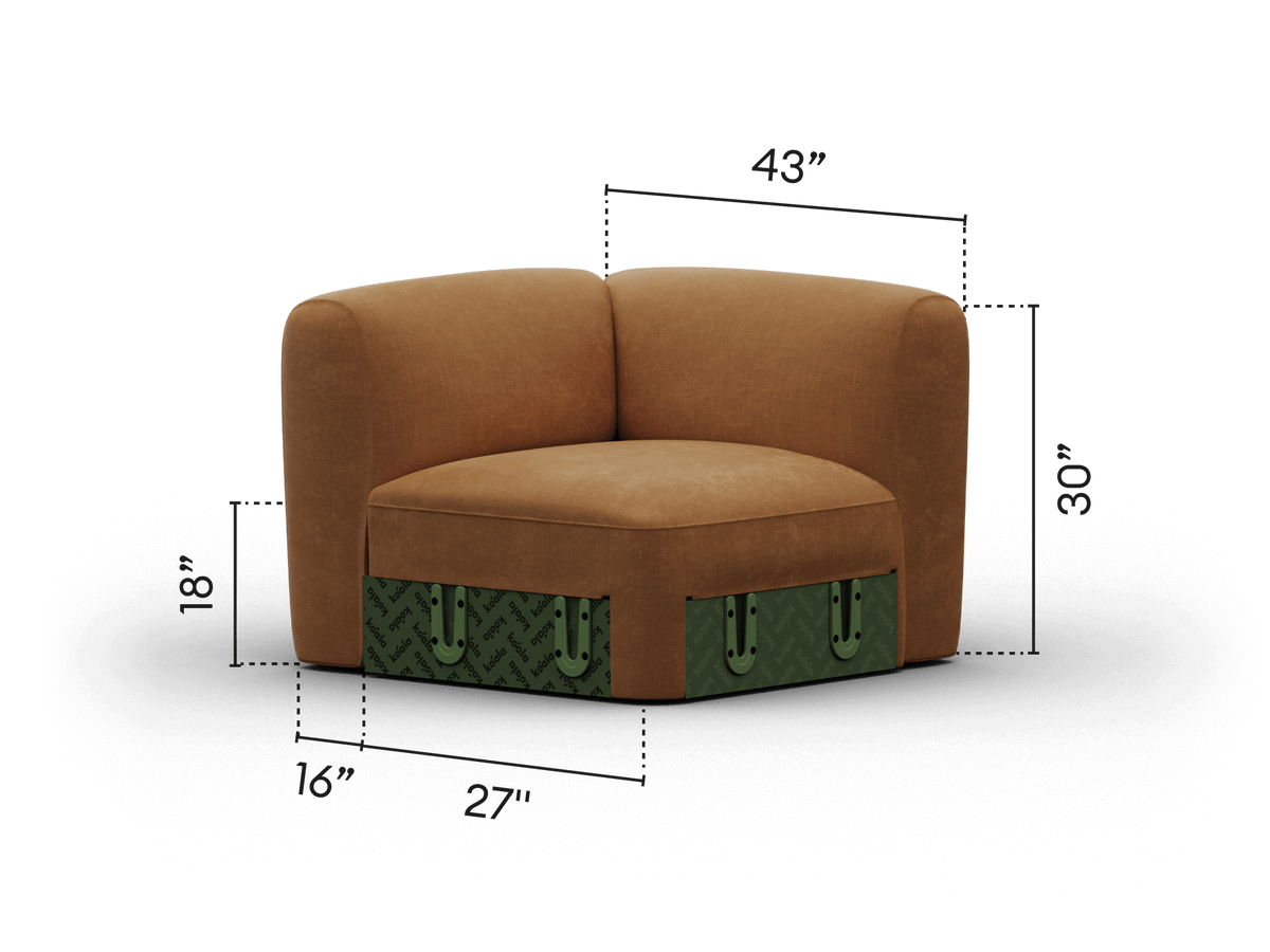 Luxurious corner chair featuring a tan fabric upholstery with plush cushioning, accented by a distinctive green patterned trim. Perfect for elegant, modern interiors.