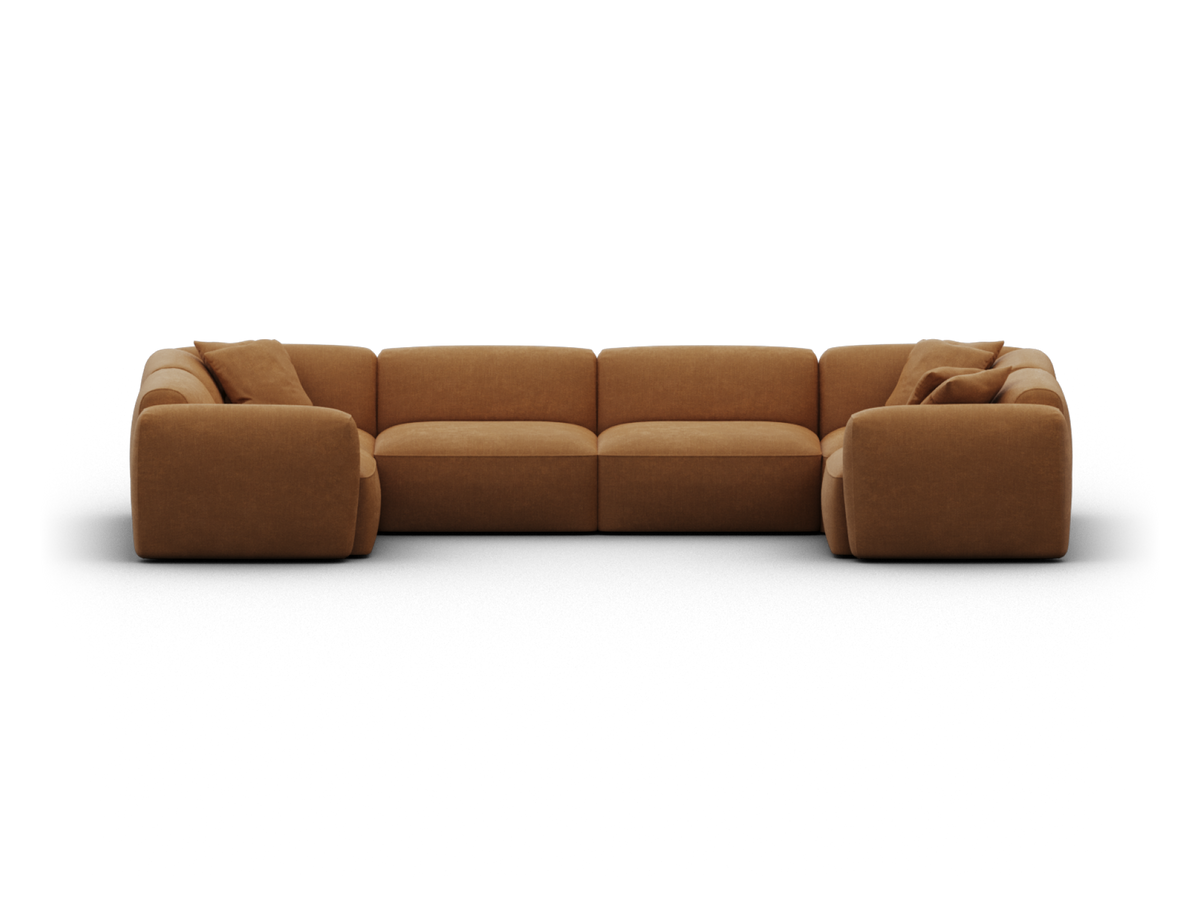 Spacious modular sectional sofa in rich caramel leather, featuring deep cushions, rounded armrests, and a modern silhouette. Ideal for elegant living spaces.